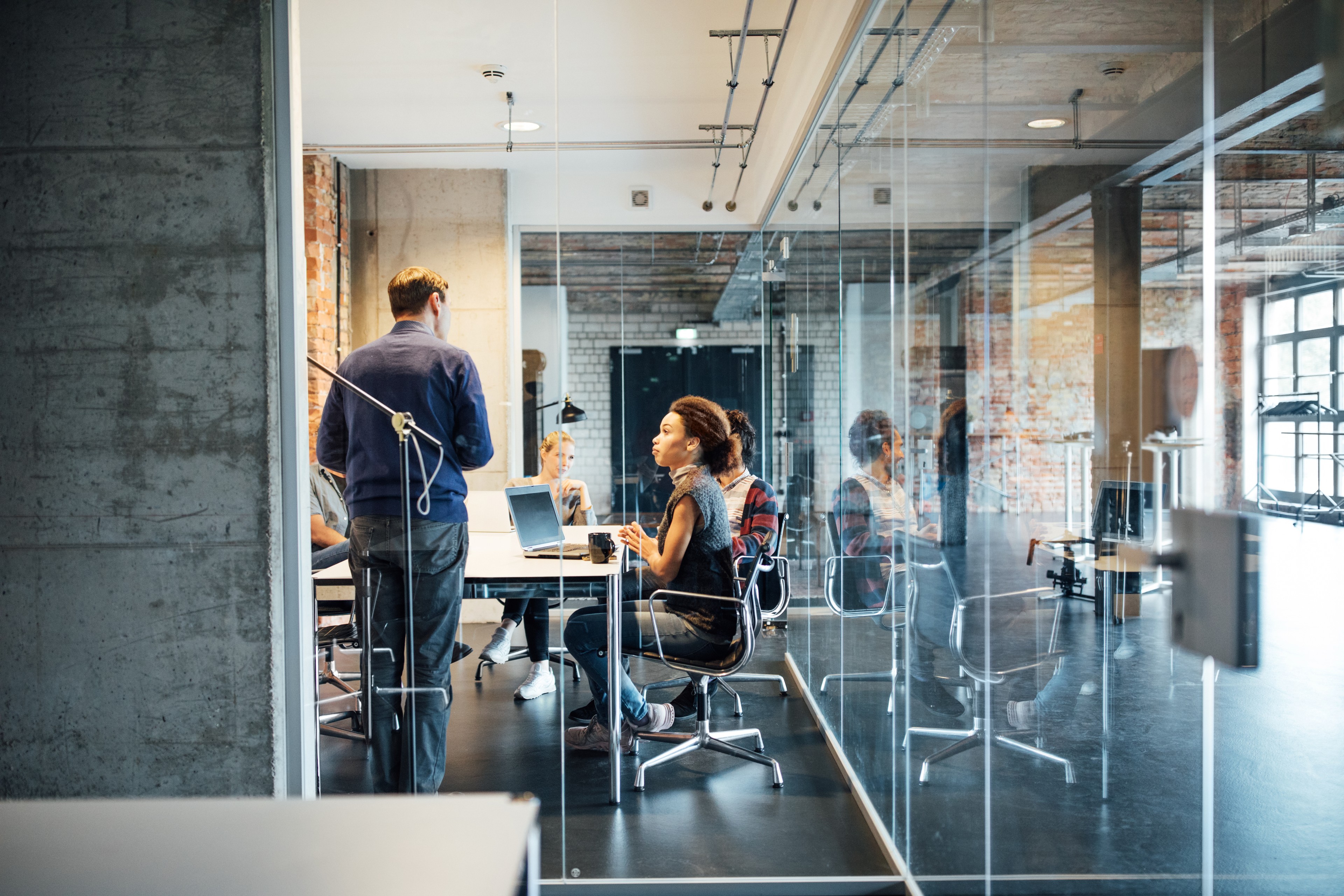 Legal officer or general counsel working in an office with colleagues